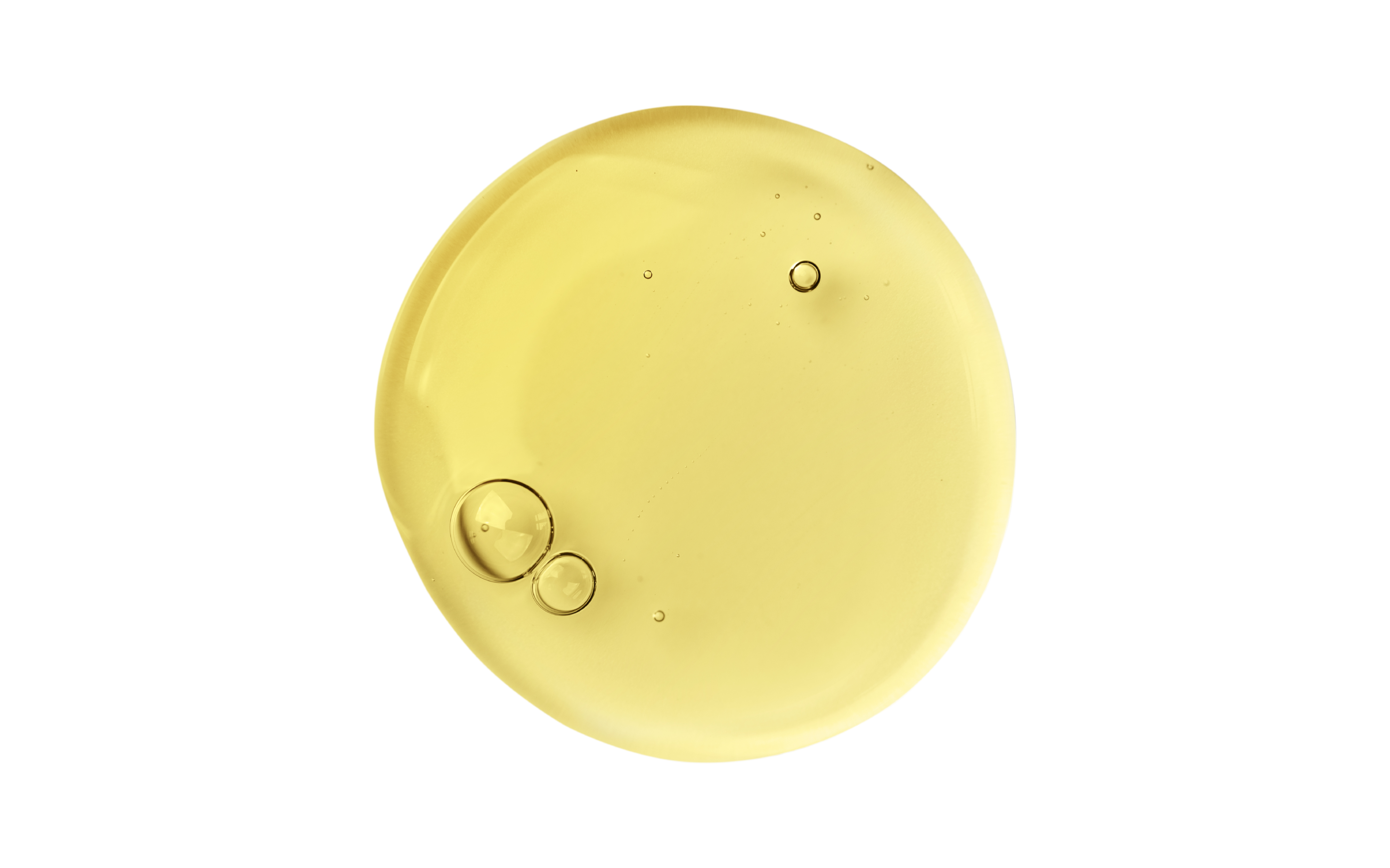 Yellow droplet with bubbles on a white background